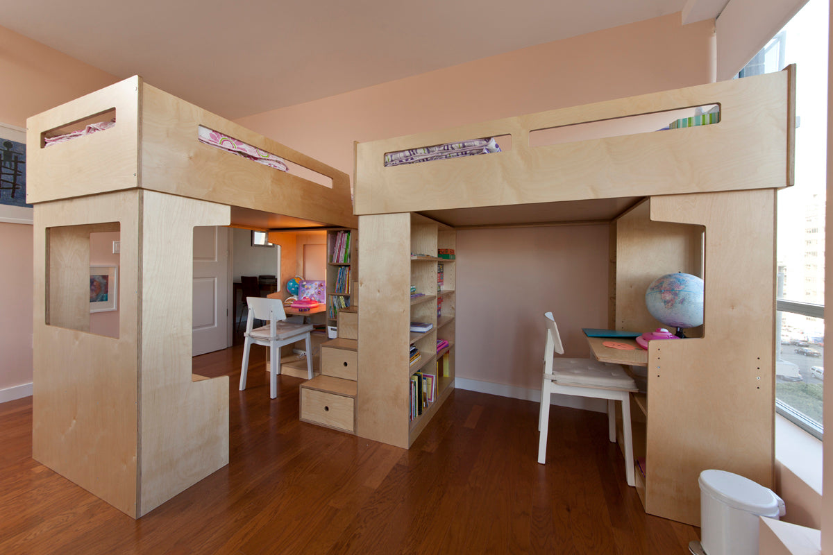 Modern loft bed with desk and shelves in bright interior.