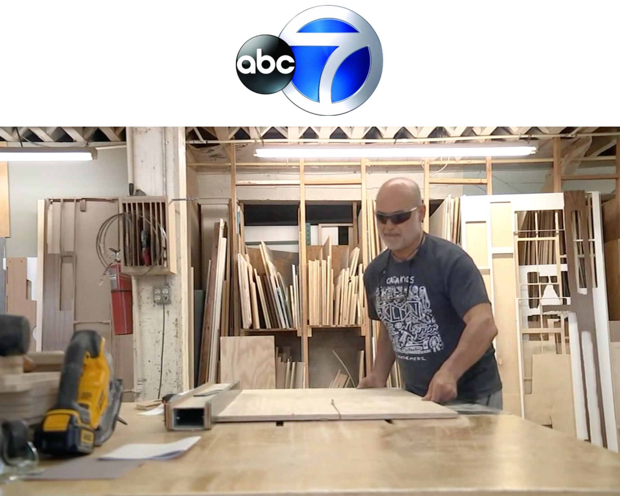 Man wearing sunglasses working with wood in a workshop, featured on ABC 7.