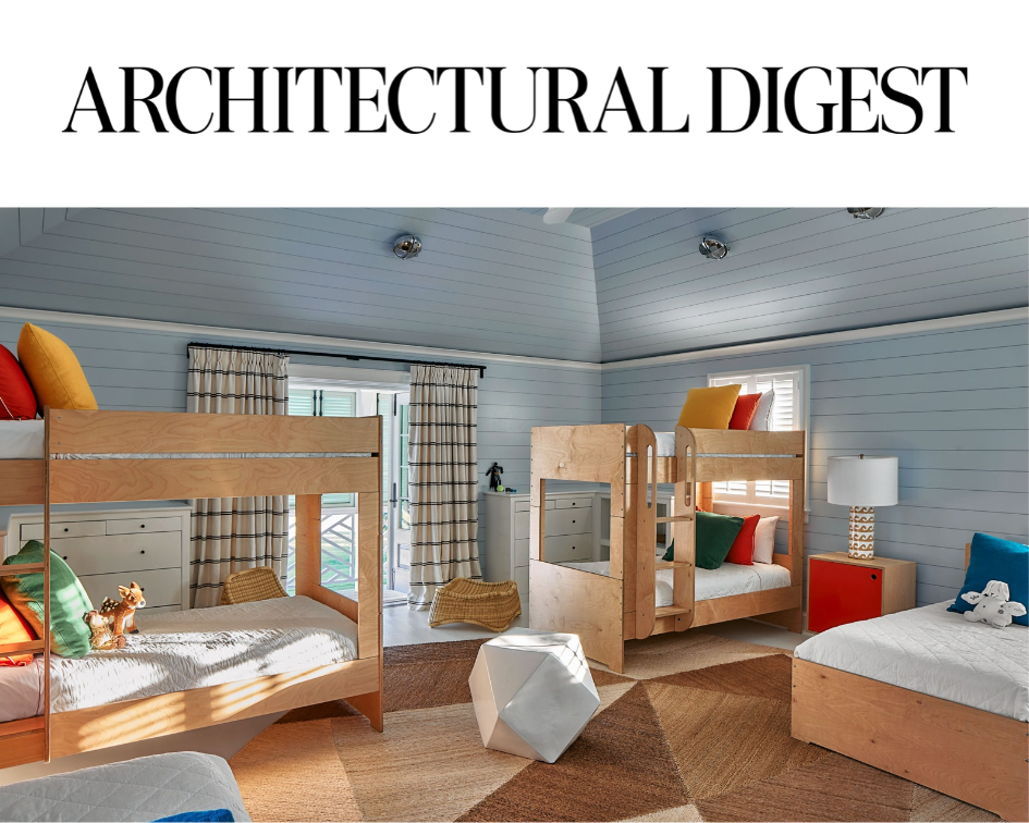 Architectural Digest styled children's room with two bunk beds and playful, modern decor.