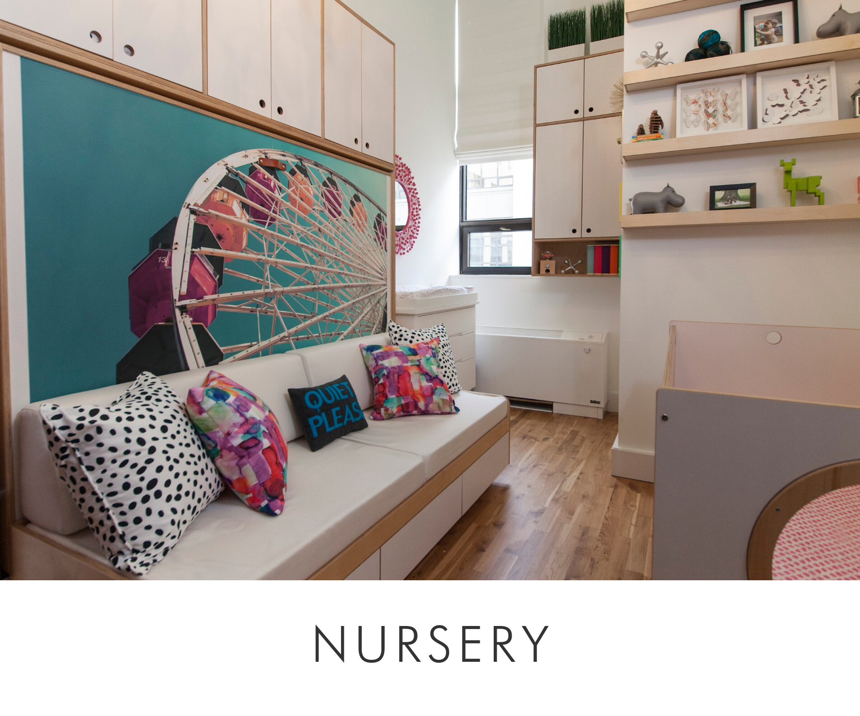 Nursery with a bench seat, colorful cushions, whimsical wall art, and open shelving.