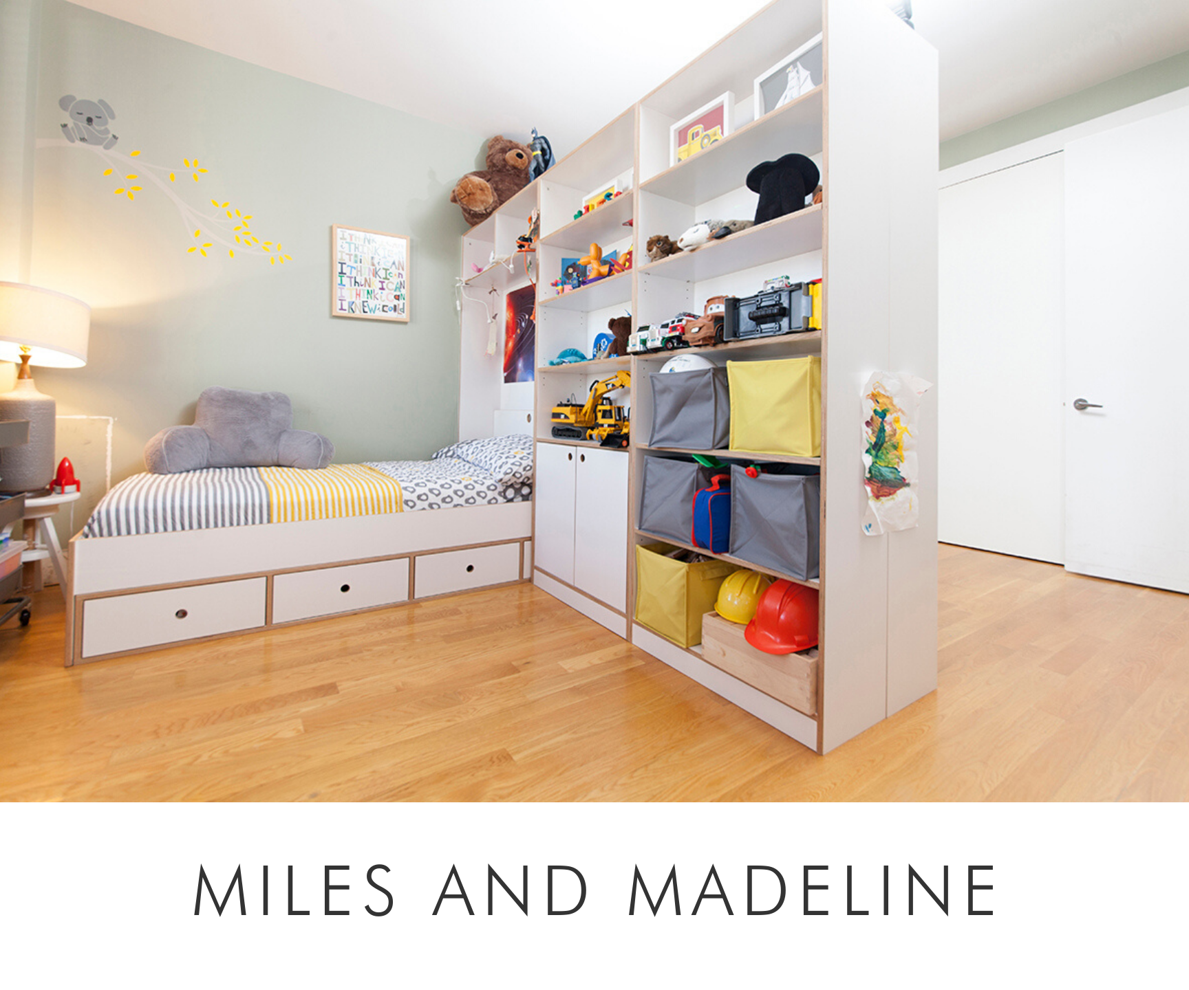 Bright children's room with a bed, playful storage unit filled with toys, and whimsical wall decals.