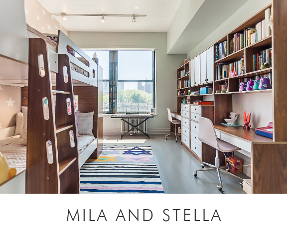 Mila and stella room with bunk beds, extensive bookshelves, desk area, and a colorful striped rug.