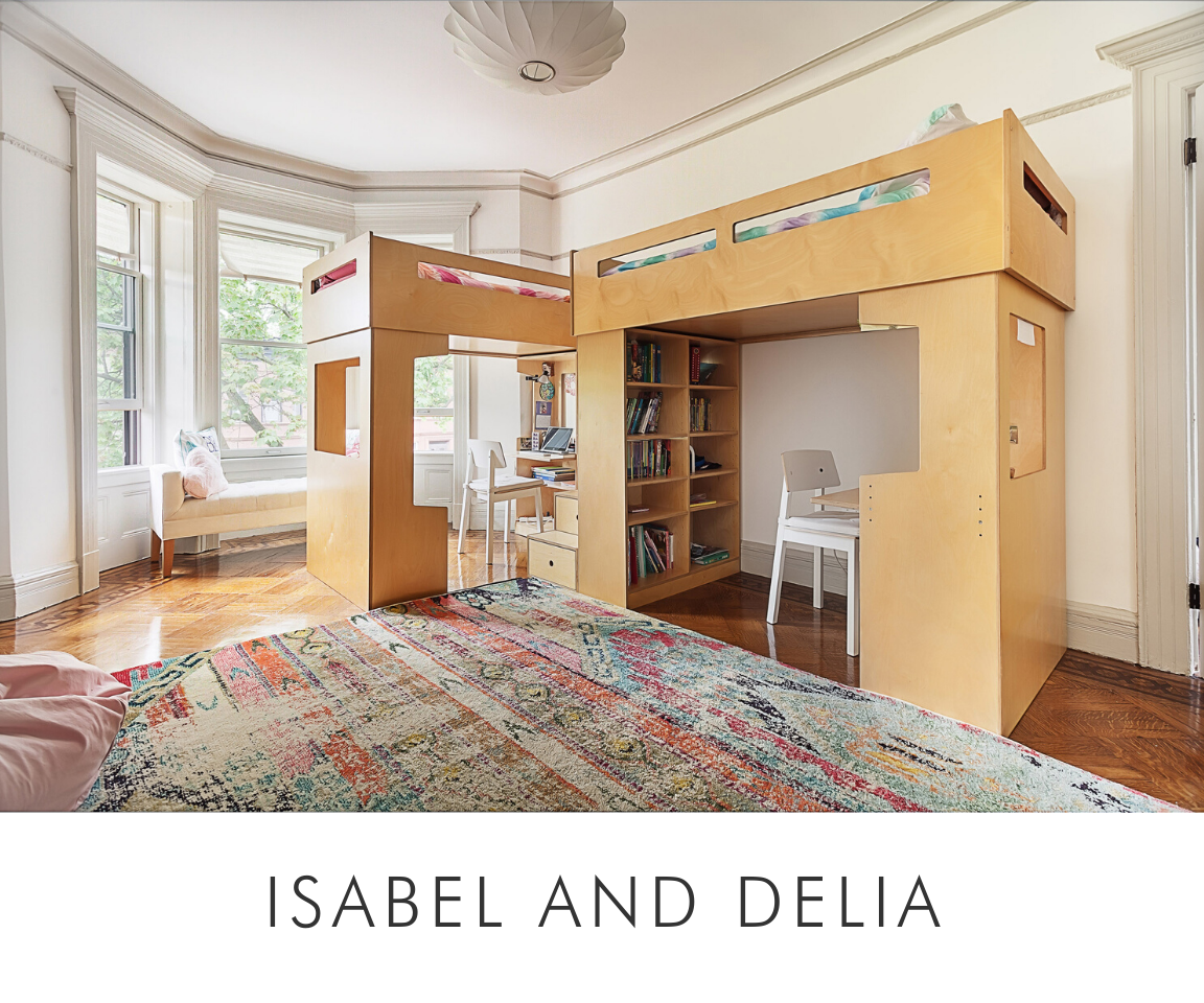 Isabel and delia spacious room featuring a loft bed, desk area, bookshelves, colorful rug, and large bay windows.