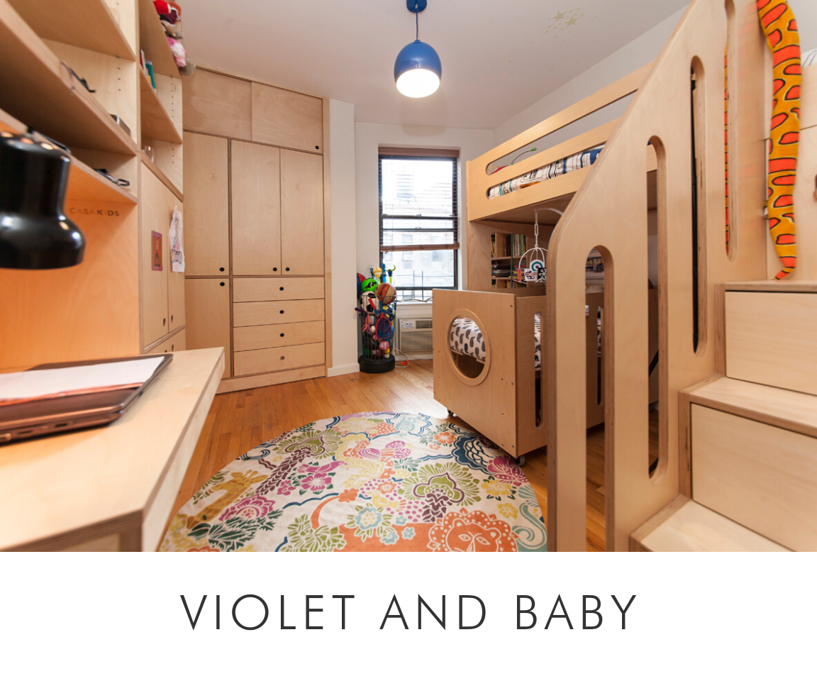 Violet and baby cozy room with floral rug, custom wooden bunk bed, cabinetry, and a study desk with a lamp.