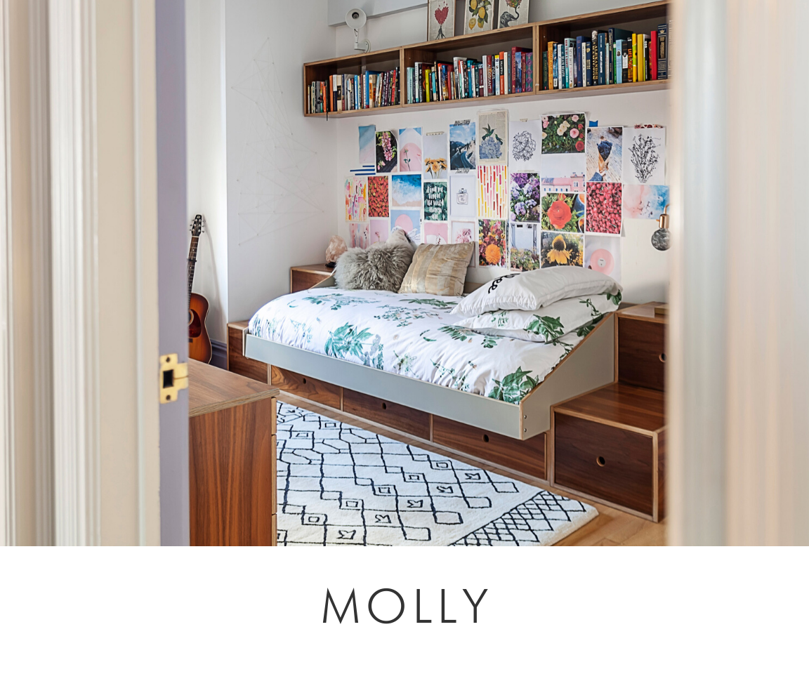 Molly room cozy bedroom with a bed, colorful posters, books on shelves, and a crossword rug.