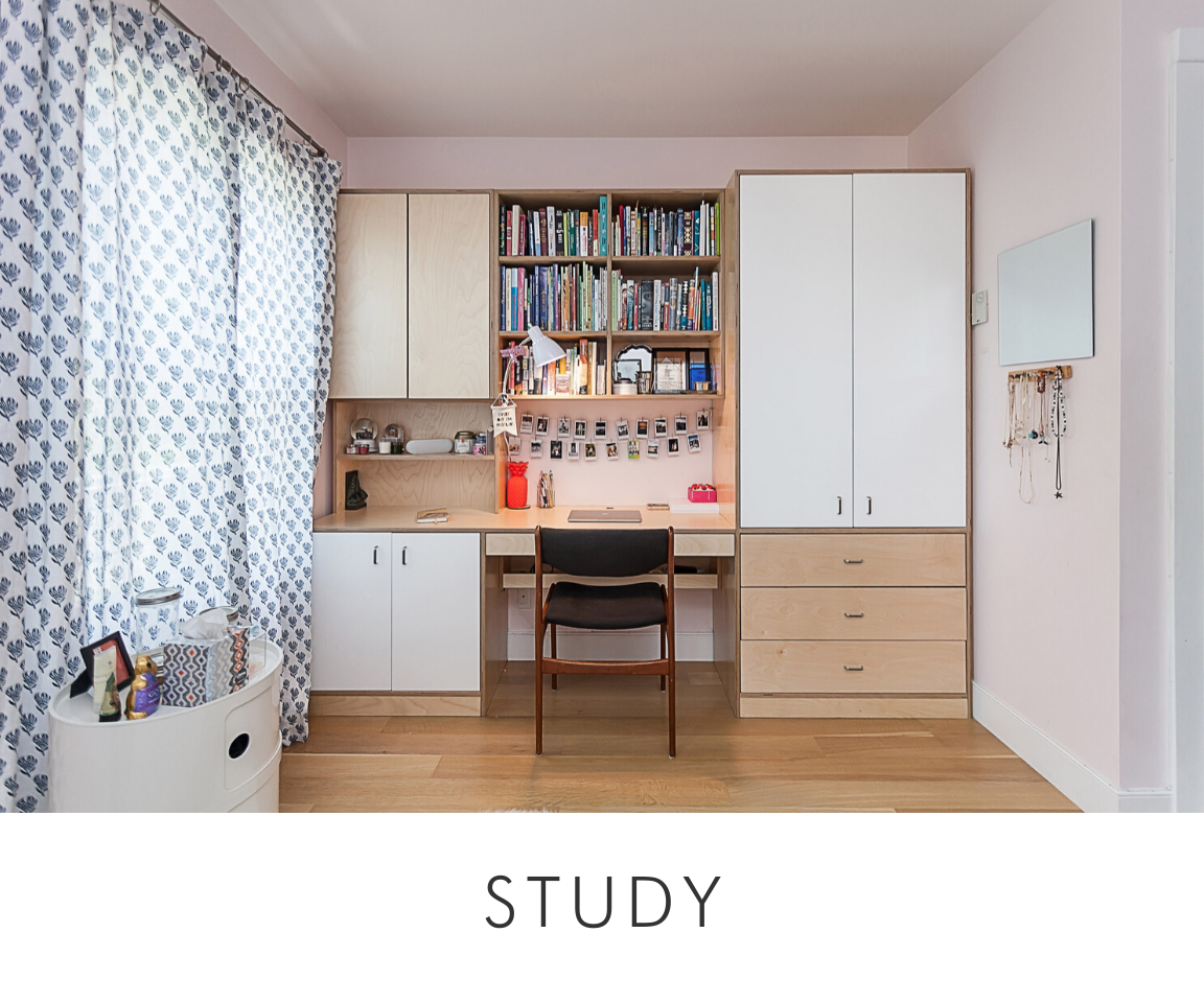 Home study area with built-in desk, cabinets, and bookshelves, a comfortable chair, and stylish drapes.