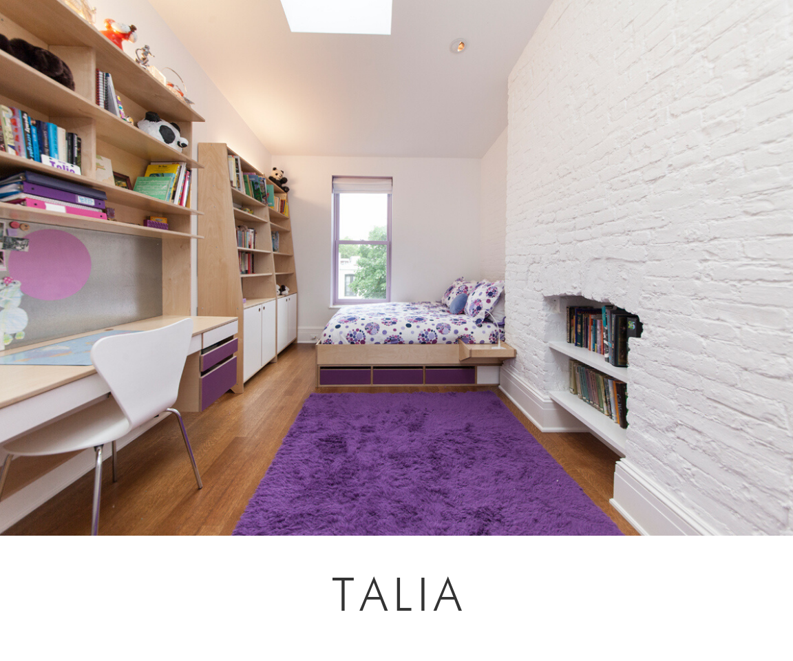 Talia room bright room with a study desk, bed, bookshelves, and a vibrant purple rug against a white brick wall.