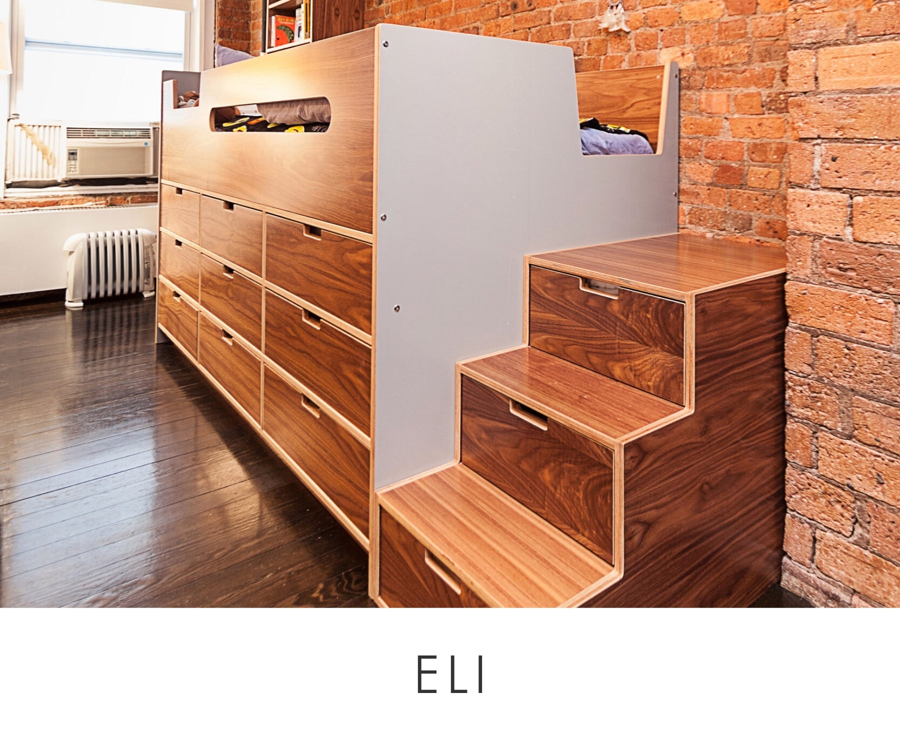 Eli room modern loft bed with wooden stairs and drawers, set against an exposed brick wall in a stylish room.