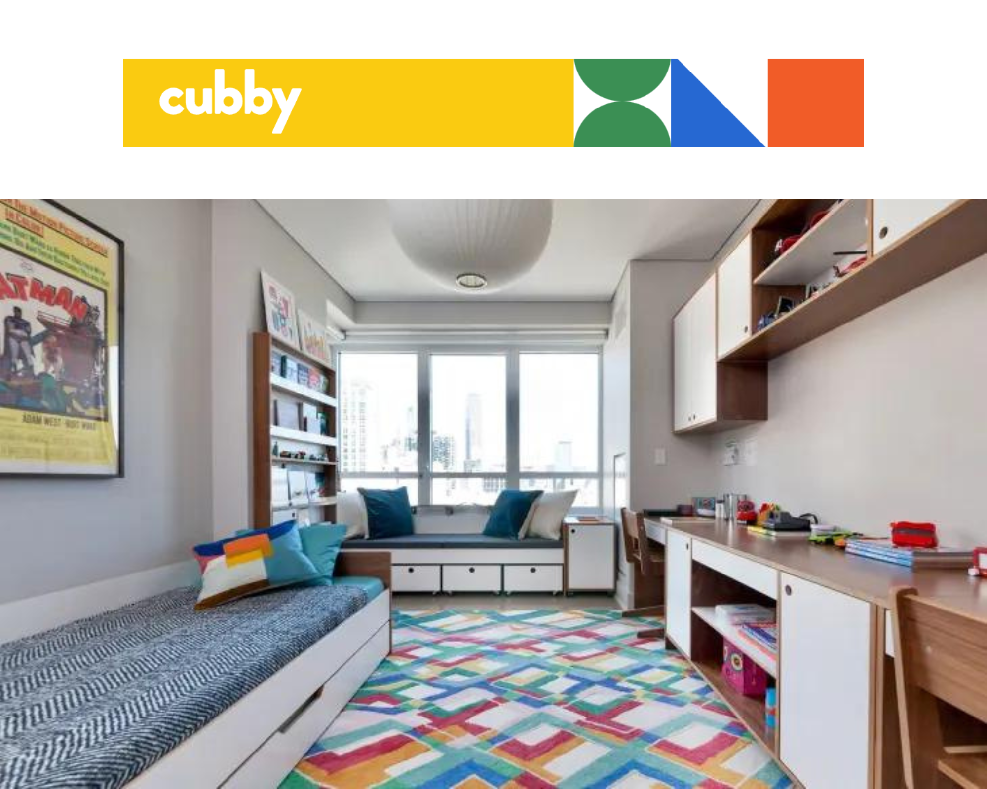 Bright child's room with colorful rug, window seat, study desk, and beds; "cubby" logo in the corner.