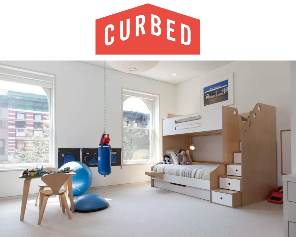 Spacious children's room with a multifunctional bed setup, exercise balls, and a play table.