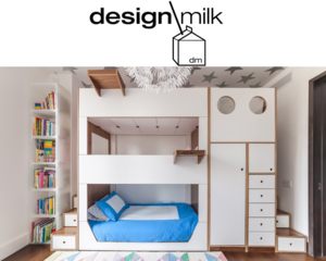 Stylish children's room with a white bunk bed, integrated shelves, and a colorful rug.