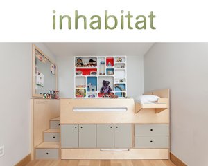 Minimalist children's bedroom with a loft bed, built-in storage, and a display of personal items.