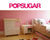 Pink bedroom, POPSUGAR logo, furniture, flower rug.