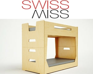 Wooden modular child’s chair with “SWISS MISS” text above.