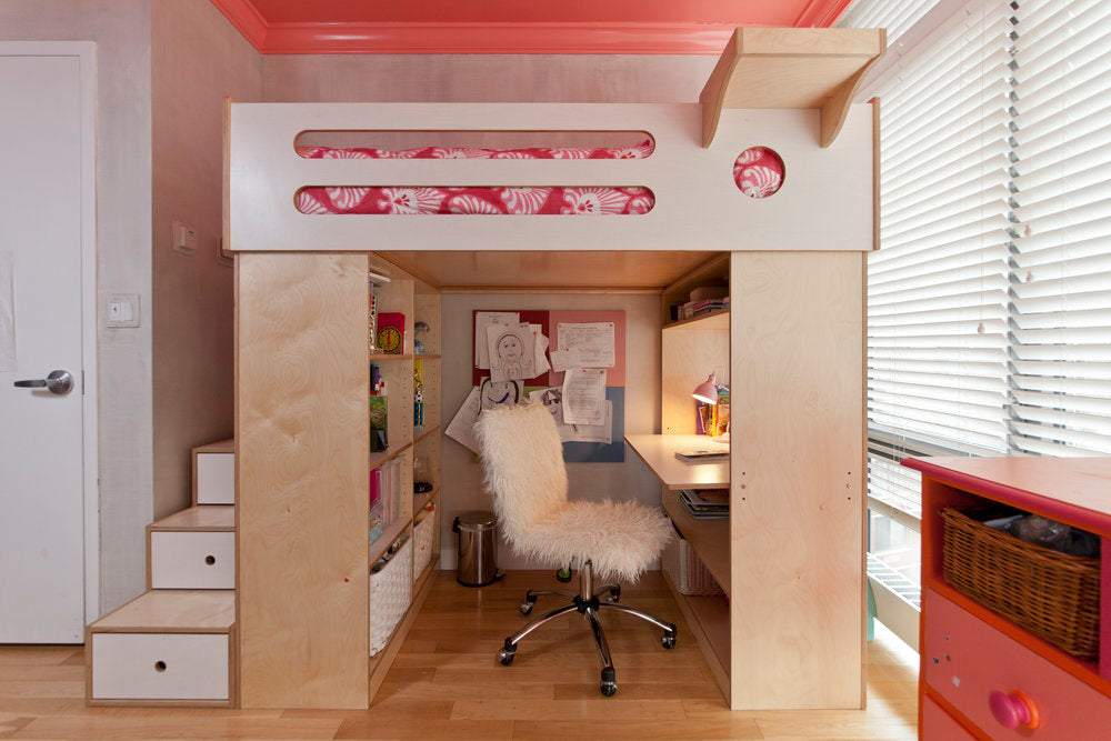 Modern home office with pink accents and sleek design.