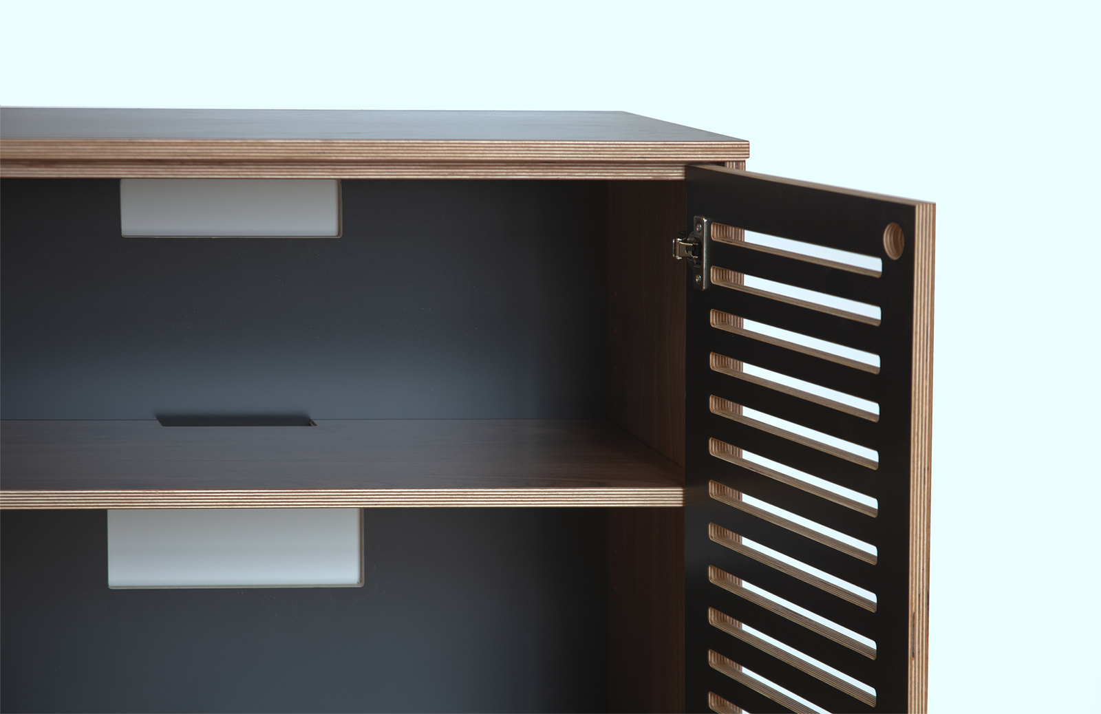 Close-up of an open wooden cabinet showing interior shelves and unique slatted door design.