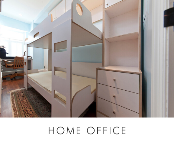 Unique home office with a bunk bed, integrated storage units, and a view into another office area.
