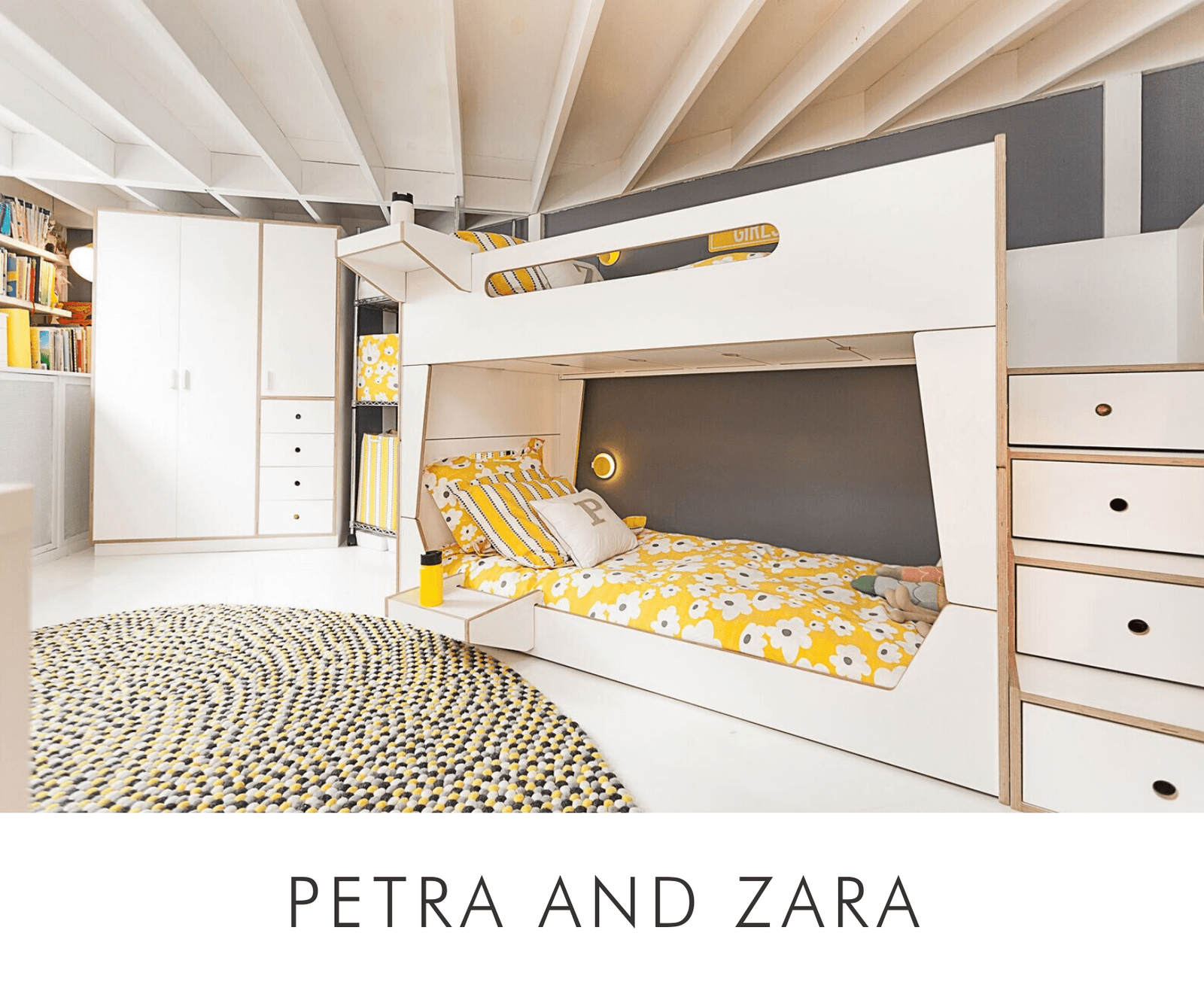 Modern bedroom with white bunk beds, yellow bedding, circular rug, and built-in shelves.