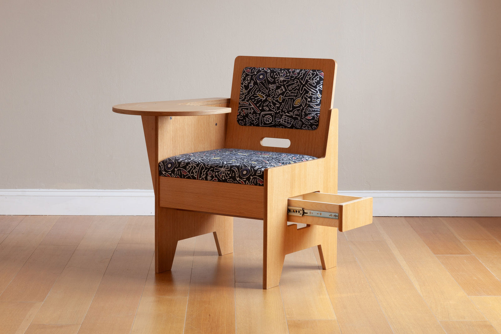 Oak work desk for adults with custom graffiti upholstery. Side drawer under seat opened