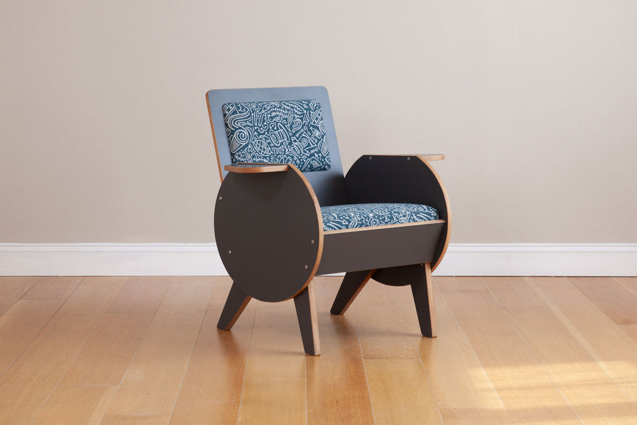 front side view of gray armchair with custom graffiti upholstery