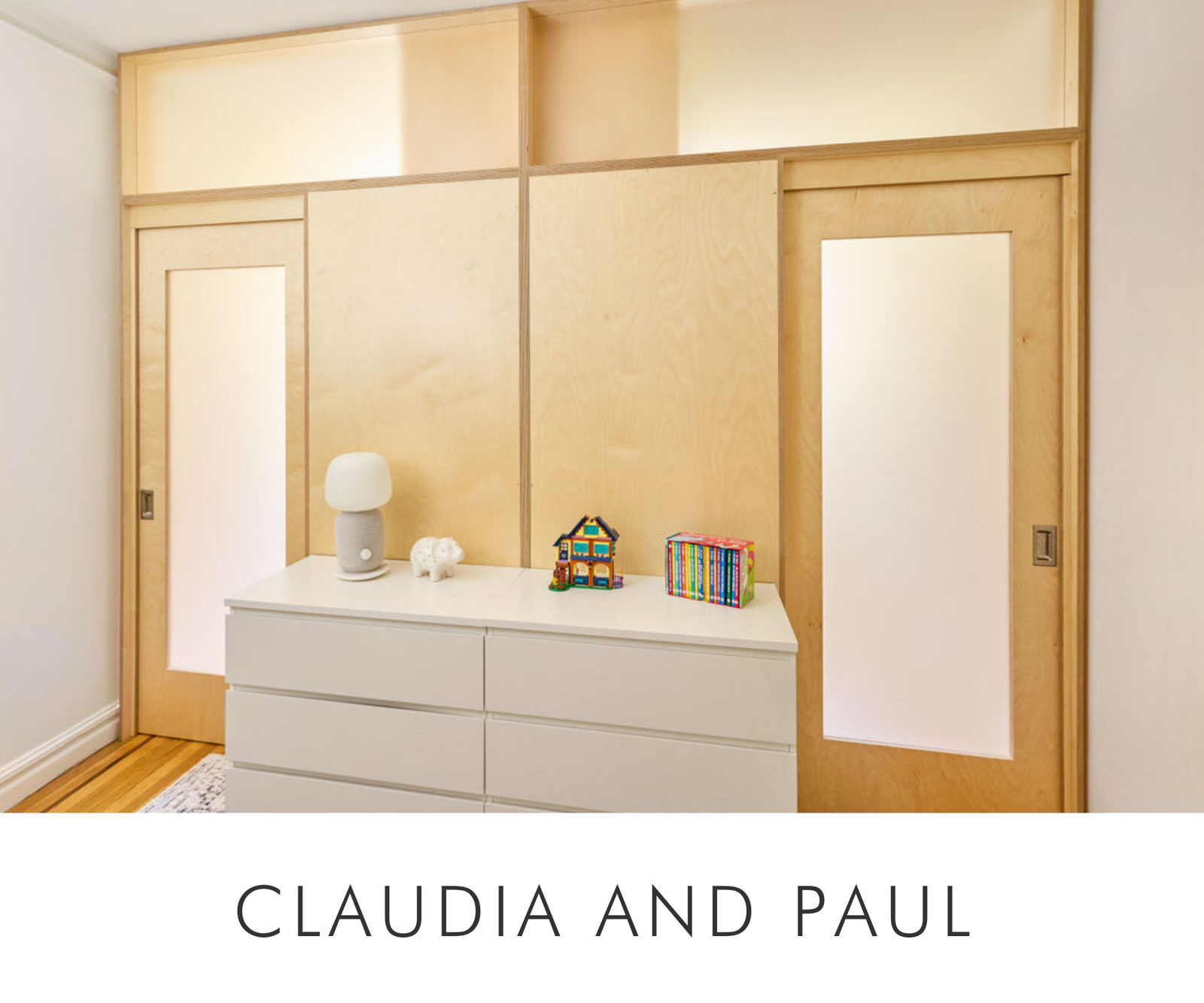 Claudia and Paul's shared room featuring a bunk bed room division with birch-finished pocket doors. The design maximizes functionality and privacy, complemented by a sleek white dresser and warm natural wood tones.