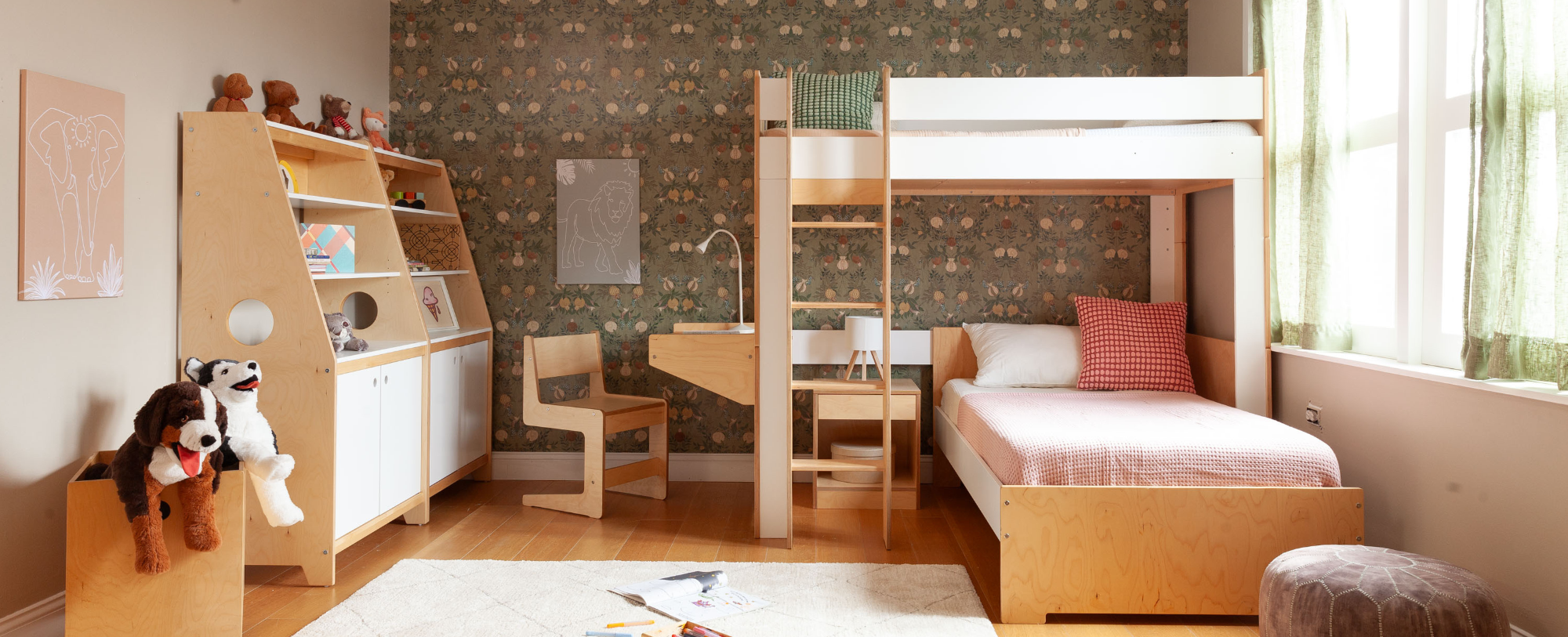 birch and white finished L shaped bunk bed and storage units in room w green floral wallpaper