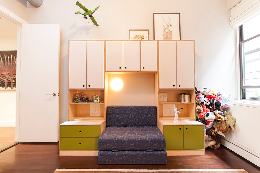 Cozy room with cabinets, steps, plush toys on the right