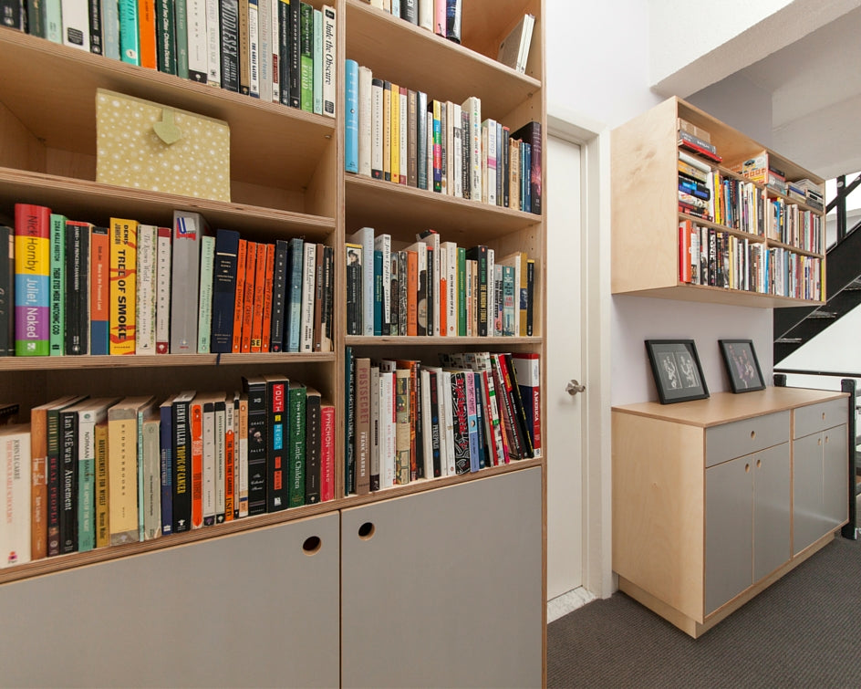  Cozy corner with bookshelves and colorful books.