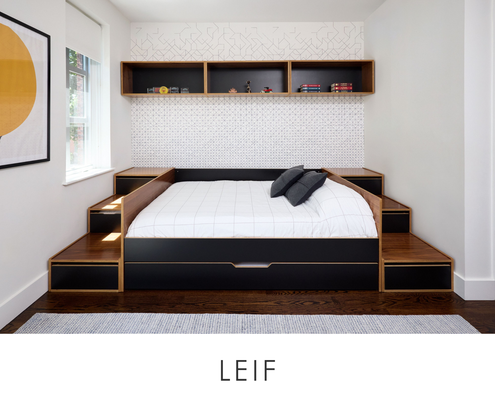 Image of Leif's room. A walnut with black painted accent daybed with storage cabinets flanking the bed and upper storage cabinet above the bed