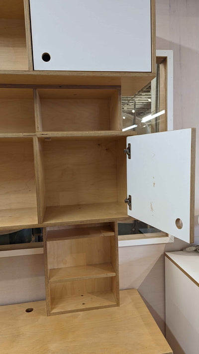 Custom desk-view of upper shelves with doors