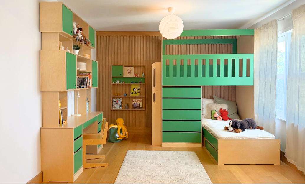 Green bunk bed, desk and wall shelf set in light wood kid's room
