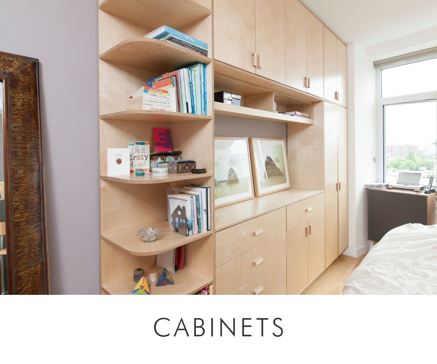 Custom birch bedroom cabinetry with open shelving, drawers, and closed storage, designed for maximizing space and organization.