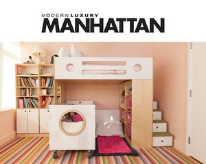 Children's bedroom with a playful loft bed, colorful striped rug, and built-in storage units.