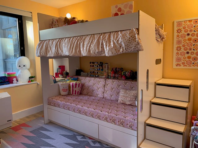 White loft bed over daybed and desk