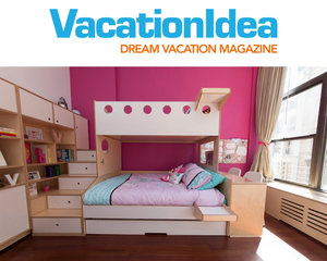 Bright bedroom with a pink wall and multi-tiered wooden bed with built-in storage and a window