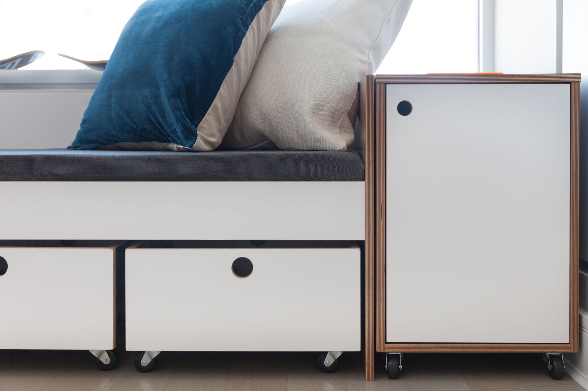 toy carts and rolling cabinet with seating in walnut finish with white accents