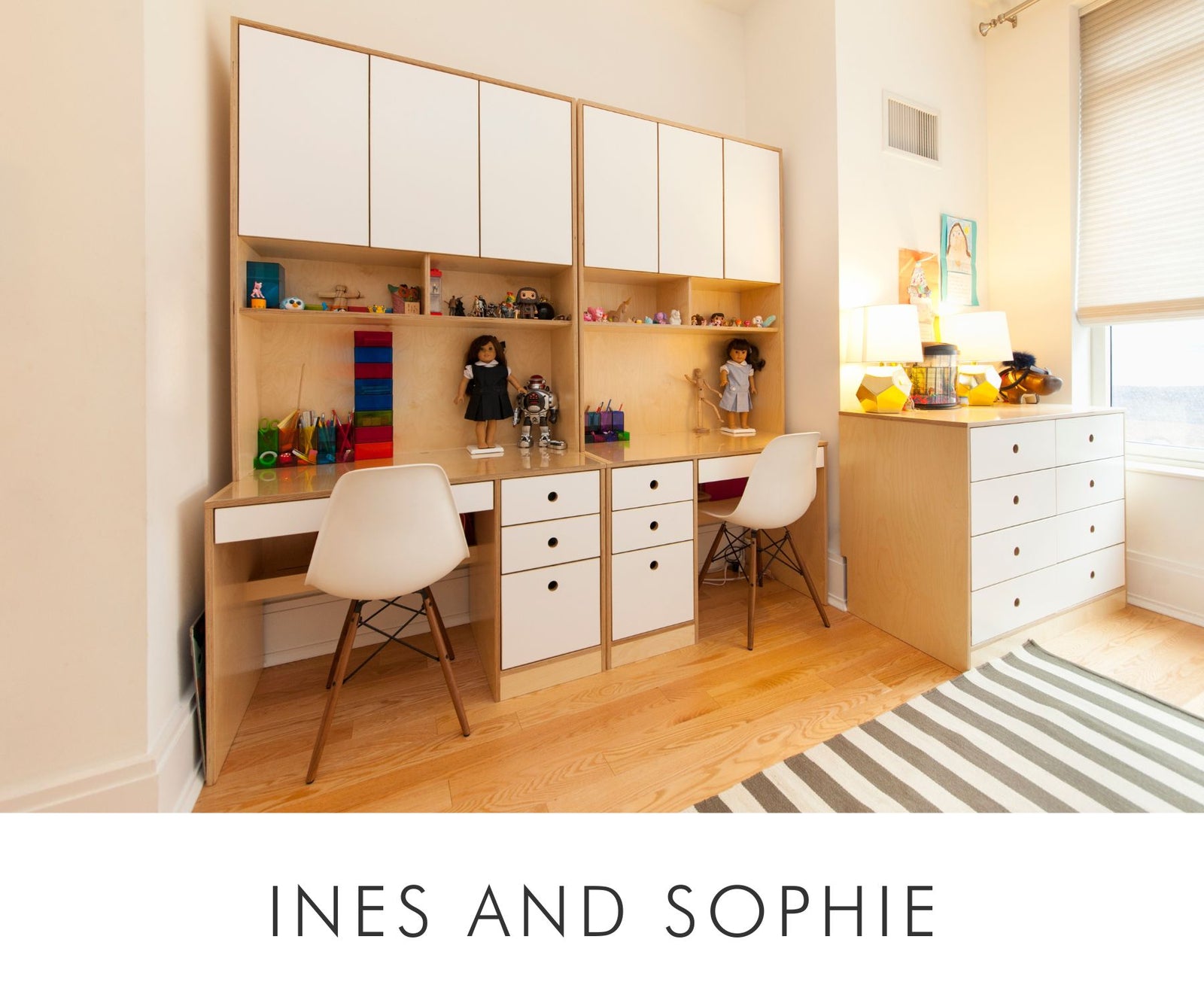 Custom kids' furniture set in birch plywood with white accents, featuring a double study desk, ergonomic chairs, overhead storage, and a matching dresser — perfect for shared spaces.