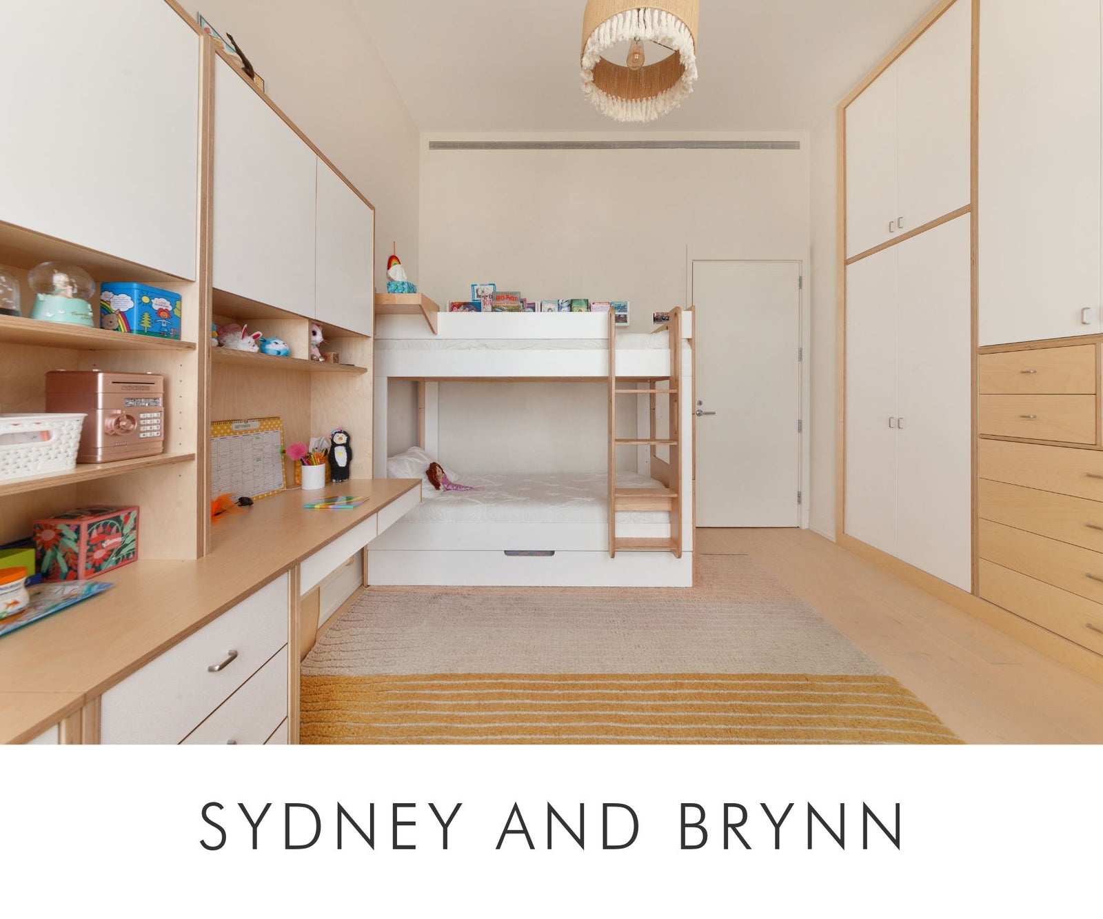 Custom shared kids room designed for Sydney and Brynn featuring bunk bed, desk, and built-in closet by Casa Kids