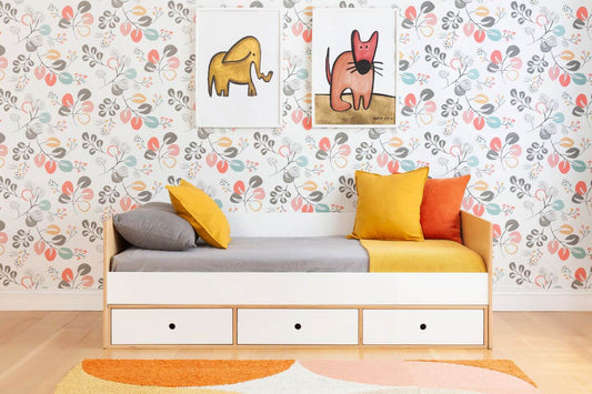 Birch and white wood twin daybed with headboard and footboard, integrated storage drawers in birch and white with yellow and grey bedding against floral wallpaper 