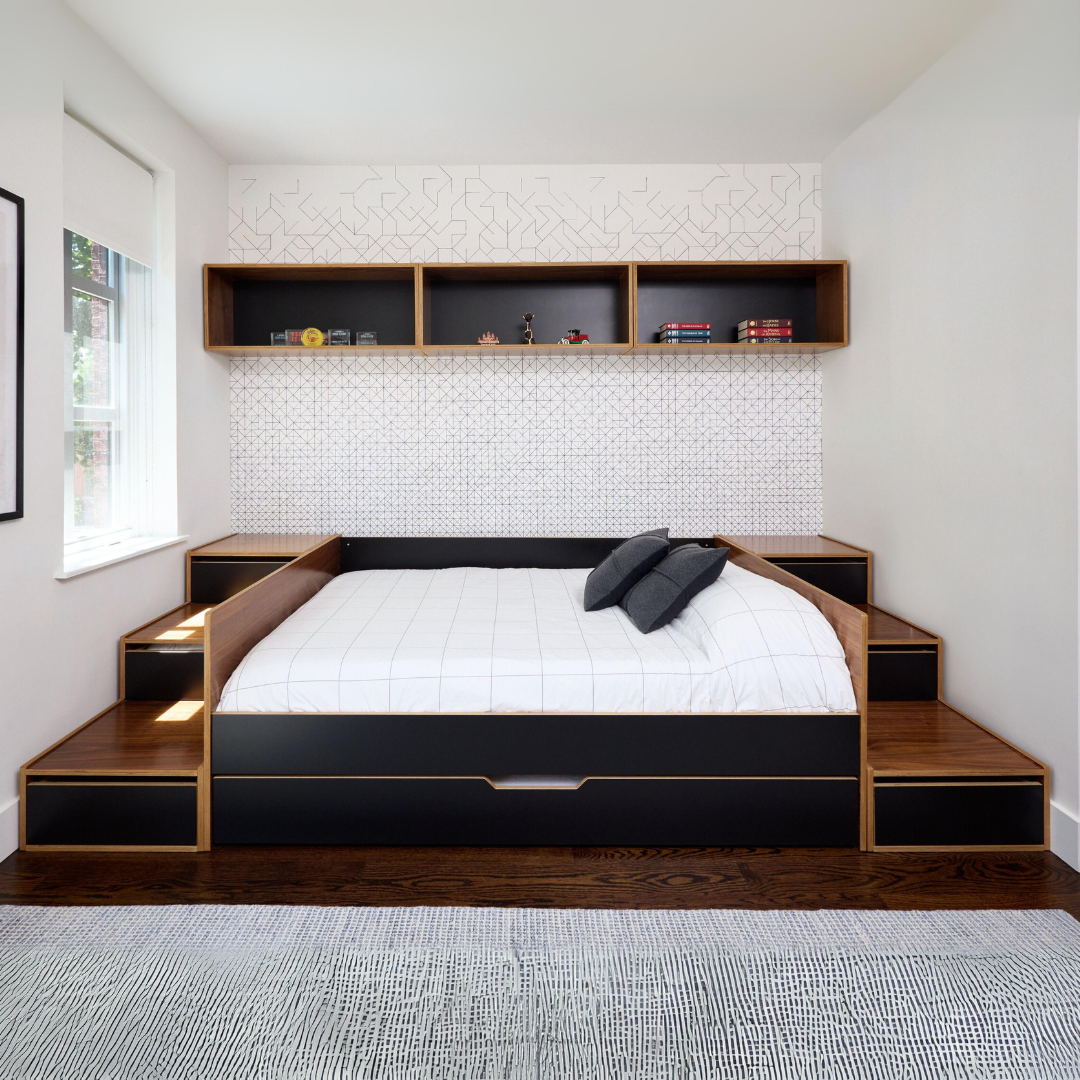 Bed setup with black and walnut finish, featuring built-in storage drawers in stair-like steps on both sides and a trundle bed underneath.