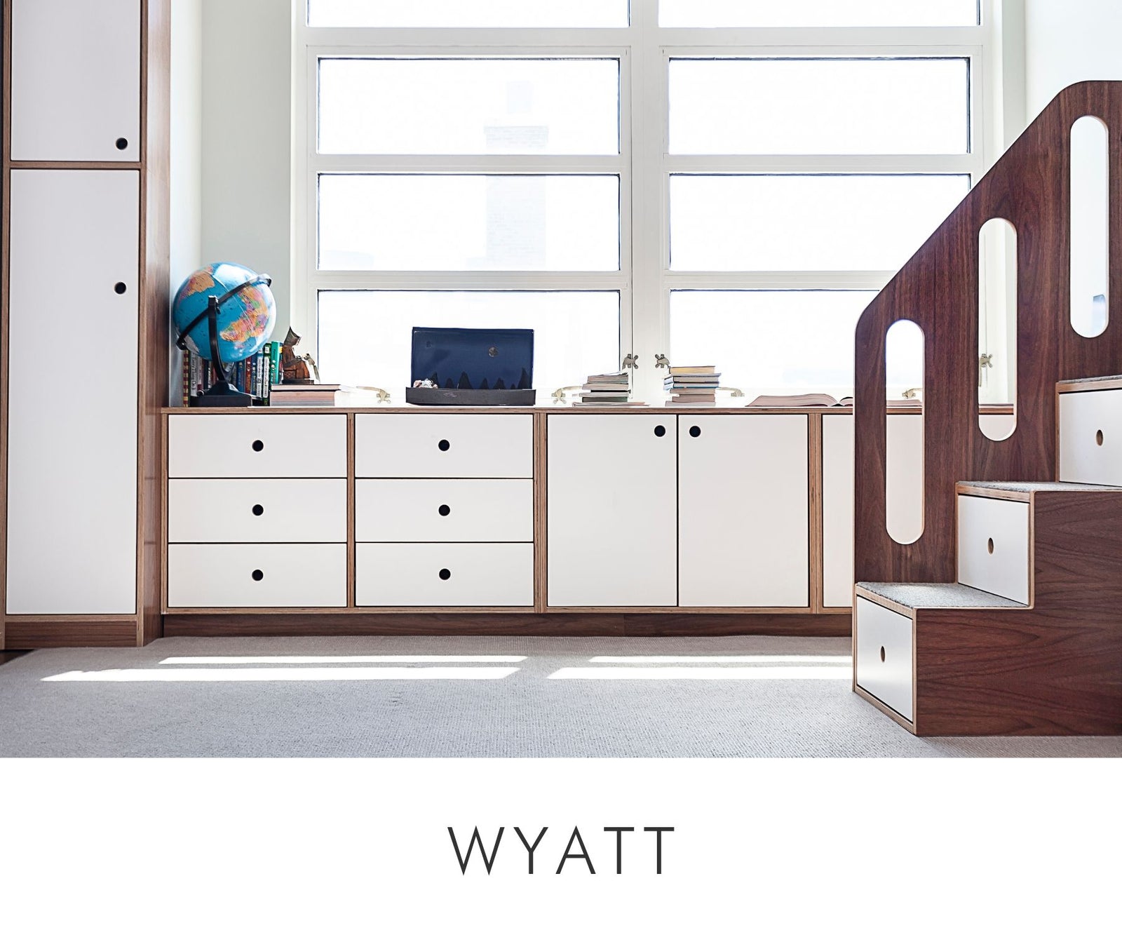 Custom kids’ room cabinetry in walnut and white finish featuring drawers, cabinets, and integrated stair storage — designed for functional organization with a modern aesthetic.