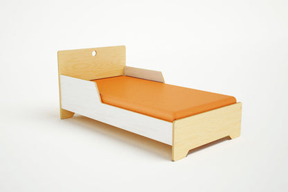 Compact Marino Junior Bed in natural wood, featuring a low-profile design perfect for toddlers transitioning to a big bed.